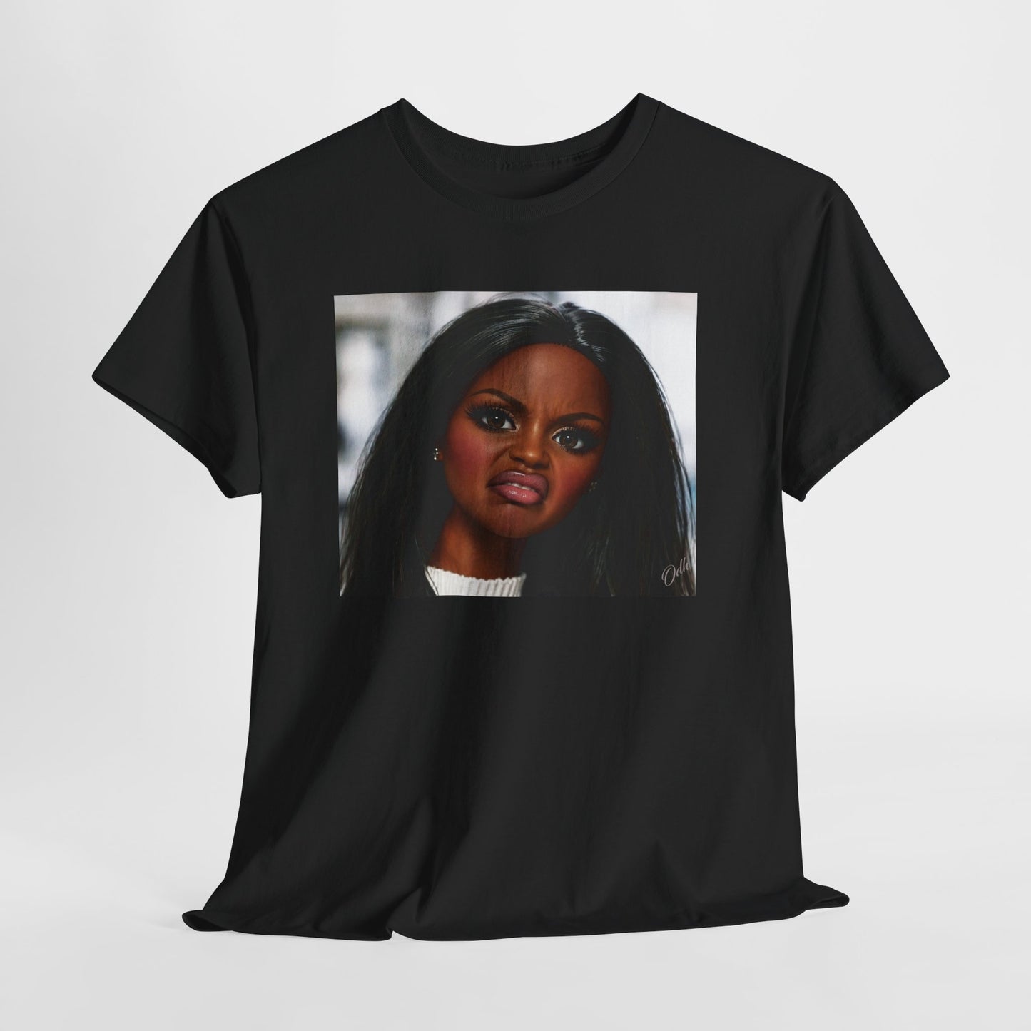Black t-shirt with a graphic of a Black woman's face Black barbie doll Disgusted facial expression on a white background